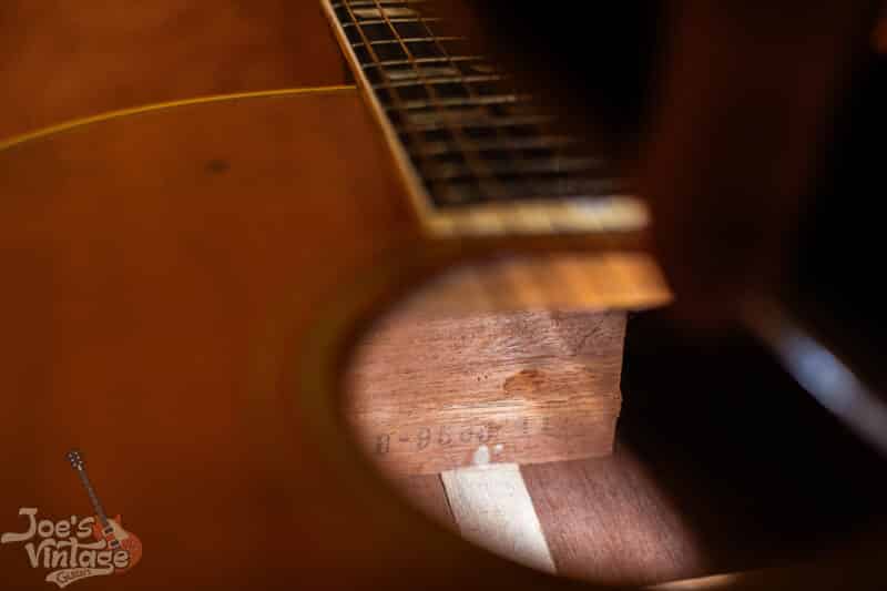 A Gibson factory order number stamped inside of a guitar.