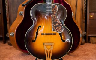 A frontal view of a 1937 Gibson Super 400